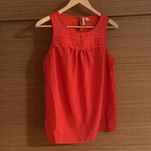Sleeveless blouse with ruffled accent